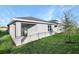 Home exterior showcasing a covered patio and yard at 6333 Clover St, Lake Hamilton, FL 33851