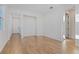 Bright foyer with wood-look tile flooring and access to other rooms at 6333 Clover St, Lake Hamilton, FL 33851