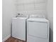 Laundry room with washer, dryer, and overhead shelving at 6333 Clover St, Lake Hamilton, FL 33851