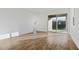 Living room with sliding glass door to backyard patio at 6333 Clover St, Lake Hamilton, FL 33851