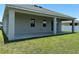 Covered patio with concrete flooring and grassy yard at 2757 Creekmore Ct, Kissimmee, FL 34746