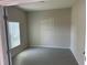 Small office with neutral walls, tile floor, and a window at 2757 Creekmore Ct, Kissimmee, FL 34746