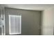 Simple bedroom with neutral walls and window blinds at 2757 Creekmore Ct, Kissimmee, FL 34746