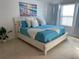 Bright bedroom with a beach themed decor at 793 Benoi Dr, Davenport, FL 33896