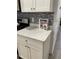 Kitchen with white cabinets and quartz countertops at 793 Benoi Dr, Davenport, FL 33896