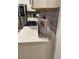 Kitchen with white cabinets and gray backsplash at 793 Benoi Dr, Davenport, FL 33896