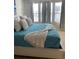 Bright bedroom with large windows and comfortable king-size bed at 793 Benoi Dr, Davenport, FL 33896