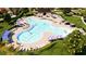Community pool with plenty of seating and umbrellas at 6333 Clover St, Lake Hamilton, FL 33851
