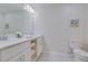 Clean bathroom with double vanity, and updated fixtures at 3121 Paradox Circle 207 # 207, Kissimmee, FL 34746