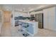 Modern kitchen with stainless steel appliances and an island at 3121 Paradox Circle 207 # 207, Kissimmee, FL 34746