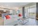 Open concept living space with white sectional sofa and kitchen views at 3121 Paradox Circle 207 # 207, Kissimmee, FL 34746