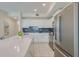 Modern kitchen with stainless steel appliances and white cabinetry at 3121 Paradox Circle 207 # 207, Kissimmee, FL 34746