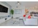 Spacious living room boasts a white sectional sofa, large TV, and modern decor at 3121 Paradox Circle 207 # 207, Kissimmee, FL 34746