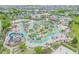 Expansive community pool and recreation area with multiple pools and a waterslide at 3121 Paradox Circle 207 # 207, Kissimmee, FL 34746
