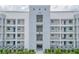 Modern building exterior with multiple balconies at 3121 Paradox Circle 207 # 207, Kissimmee, FL 34746