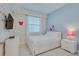 Bright bedroom with a queen bed, Mickey Mouse decor, and plenty of natural light at 3121 Paradox Circle 207 # 207, Kissimmee, FL 34746