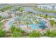 Large community pool with waterslide and plenty of lounge space at 3121 Paradox Circle 207 # 207, Kissimmee, FL 34746