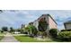 Two-story house with landscaping and palm trees at 2391 Beacon Park Landing Cir, Orlando, FL 32824