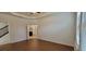 Main bedroom with wood-look floors and ensuite bathroom at 2391 Beacon Park Landing Cir, Orlando, FL 32824