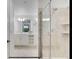 Elegant bathroom with double vanity, glass shower, and white cabinets at 3191 Paradox Cir # 205, Kissimmee, FL 34746