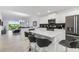 Modern kitchen with island, stainless steel appliances, and white cabinetry at 3191 Paradox Cir # 205, Kissimmee, FL 34746