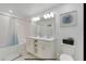 Spa-like bathroom with double vanity, large mirror, and shower/tub combo at 3191 Paradox Cir # 205, Kissimmee, FL 34746