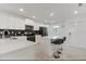 Modern kitchen with white cabinets, stainless steel appliances, and an island at 3191 Paradox Cir # 205, Kissimmee, FL 34746