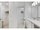 Bright bathroom with white cabinets and walk-in closet at 3191 Paradox Cir # 205, Kissimmee, FL 34746