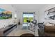 Spacious living room with large sliding glass doors leading to a balcony at 3191 Paradox Cir # 205, Kissimmee, FL 34746