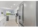 Modern kitchen with stainless steel appliances and island at 3191 Paradox Cir # 205, Kissimmee, FL 34746