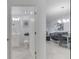 Clean bathroom with white vanity, toilet, and view into living area at 3191 Paradox Cir # 205, Kissimmee, FL 34746