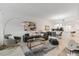Bright living room with open floor plan, gray couch, and stylish decor at 3191 Paradox Cir # 205, Kissimmee, FL 34746