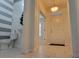 Spacious entryway with tile flooring and views to half bath and front door at 2391 Beacon Park Landing Cir, Orlando, FL 32824