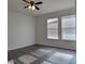Bright living room featuring hardwood floors and two windows at 2391 Beacon Park Landing Cir, Orlando, FL 32824