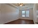 Bright bedroom with wood-look floors and ceiling fan at 2391 Beacon Park Landing Cir, Orlando, FL 32824