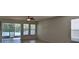 Bright living room with tile floors and sliding glass doors leading to patio at 2391 Beacon Park Landing Cir, Orlando, FL 32824