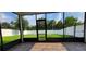 Spacious screened patio overlooking a lush green backyard at 2391 Beacon Park Landing Cir, Orlando, FL 32824