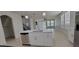 Open concept kitchen with island and stainless steel appliances at 2391 Beacon Park Landing Cir, Orlando, FL 32824