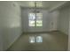 Bright dining room with chandelier and large window at 1730 Old Apopka Rd, Apopka, FL 32703
