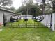 Ornate black metal gate with deer and mountain design at 1730 Old Apopka Rd, Apopka, FL 32703