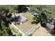 Aerial view of a house with a detached garage and fenced backyard at 1730 Old Apopka Rd, Apopka, FL 32703