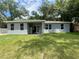 Back of house featuring a patio and large backyard at 1730 Old Apopka Rd, Apopka, FL 32703