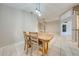 Light-filled dining area features a wood table with four chairs at 4446 Weeping Willow Cir, Casselberry, FL 32707