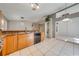 Modern kitchen with stainless steel appliances and light wood cabinets at 4446 Weeping Willow Cir, Casselberry, FL 32707