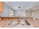 Double stainless steel sink with a modern faucet and granite countertop at 4446 Weeping Willow Cir, Casselberry, FL 32707