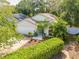 Single-story house with white garage door and green exterior at 4446 Weeping Willow Cir, Casselberry, FL 32707