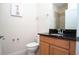 Clean bathroom with granite countertop and shower/tub combo at 301 Captiva Dr, Davenport, FL 33896