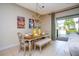 Dining area with pool access and stylish chandelier at 301 Captiva Dr, Davenport, FL 33896