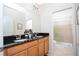 Double vanity bathroom with granite countertops and shower at 301 Captiva Dr, Davenport, FL 33896
