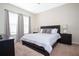 Spacious bedroom with king-size bed and large windows at 301 Captiva Dr, Davenport, FL 33896